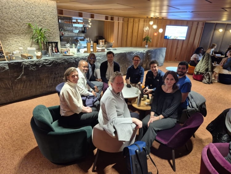 group of people sitting around a table.