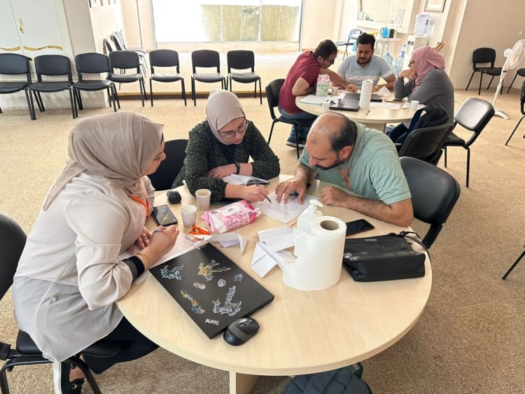 Training participants sitting around a table.